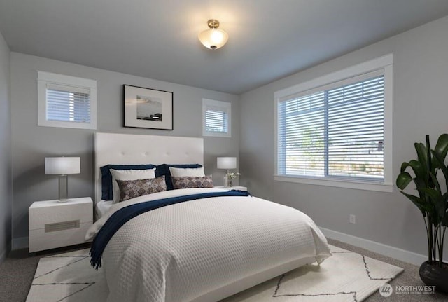 carpeted bedroom with baseboards