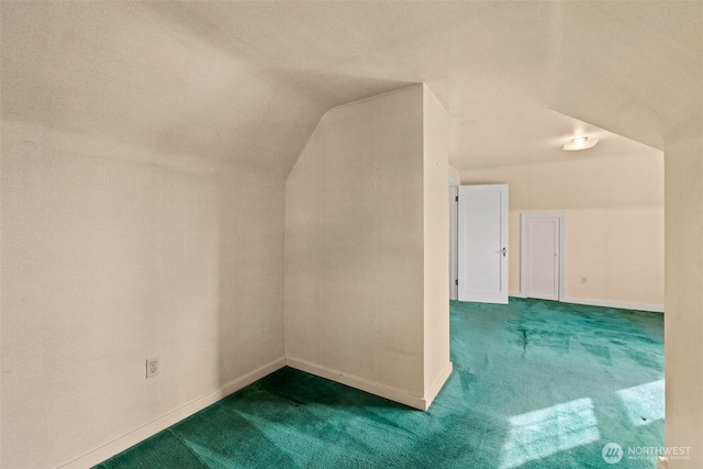 bonus room featuring vaulted ceiling, baseboards, and carpet floors