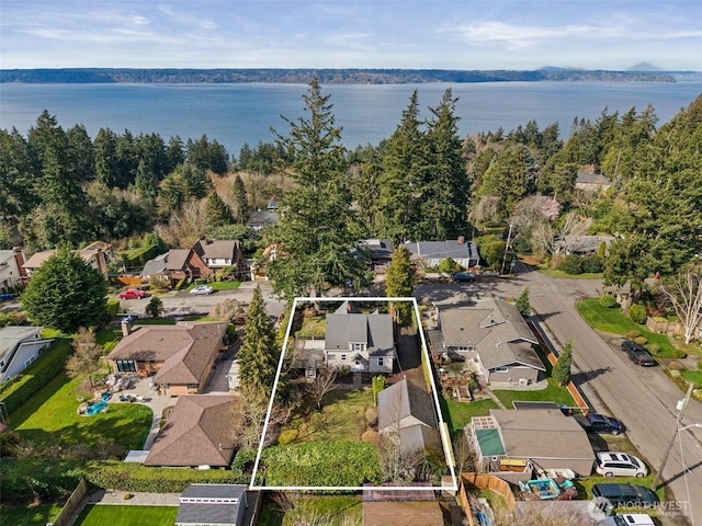 birds eye view of property featuring a residential view and a water view