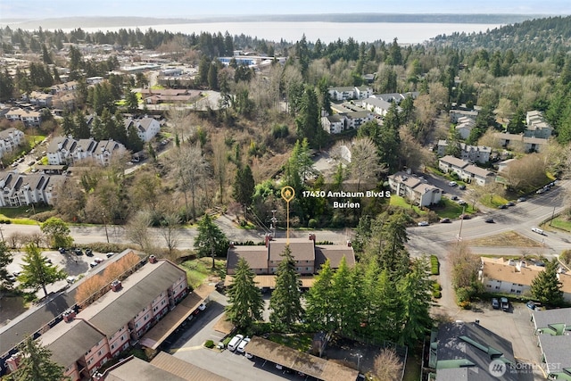 drone / aerial view featuring a water view and a residential view