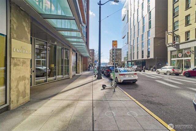 view of road with sidewalks and street lighting