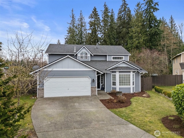 traditional-style home featuring a front yard, fence, driveway, an attached garage, and board and batten siding