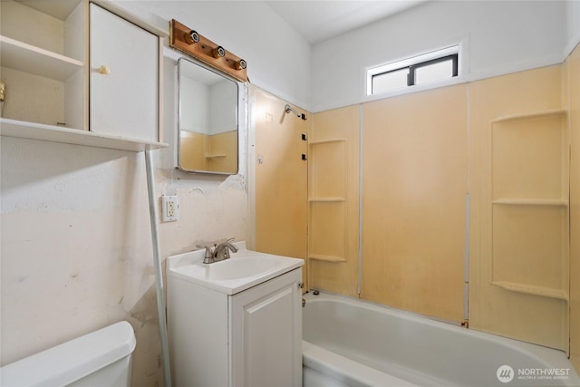 bathroom with vanity, bathtub / shower combination, and toilet