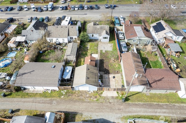 birds eye view of property with a residential view