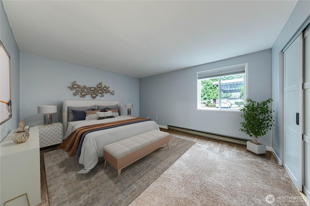 bedroom featuring carpet floors, baseboards, and baseboard heating