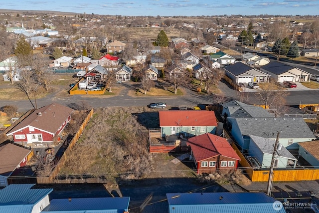 birds eye view of property with a residential view