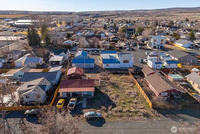 birds eye view of property with a residential view