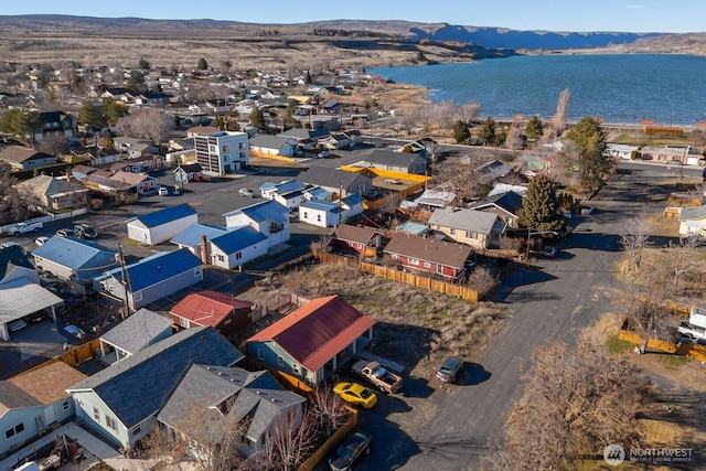 birds eye view of property featuring a residential view and a water and mountain view