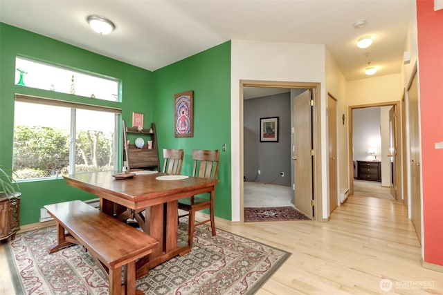 dining area with light wood finished floors