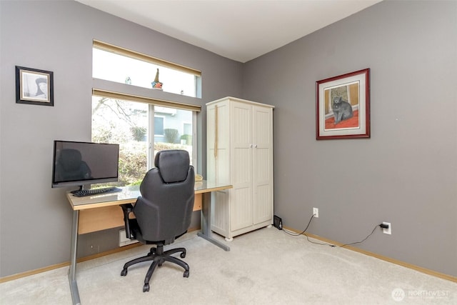 home office with light carpet and baseboards