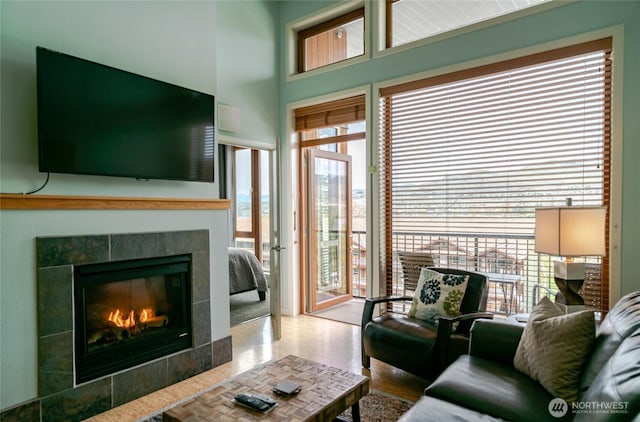 living room featuring a tile fireplace