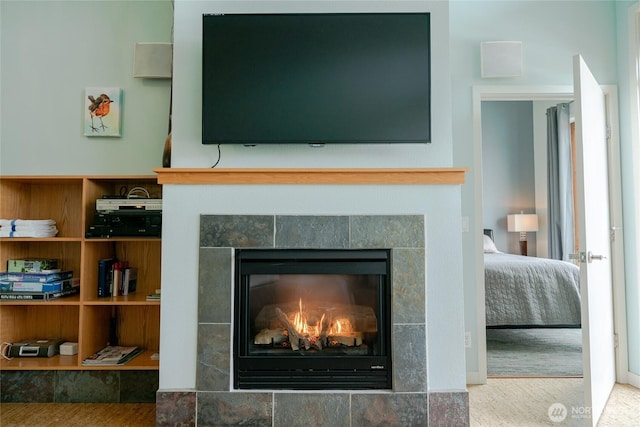 room details featuring a tile fireplace