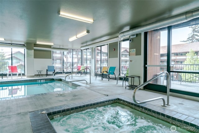 view of swimming pool featuring an indoor in ground hot tub