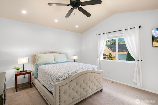 bedroom featuring vaulted ceiling, baseboards, visible vents, and light carpet