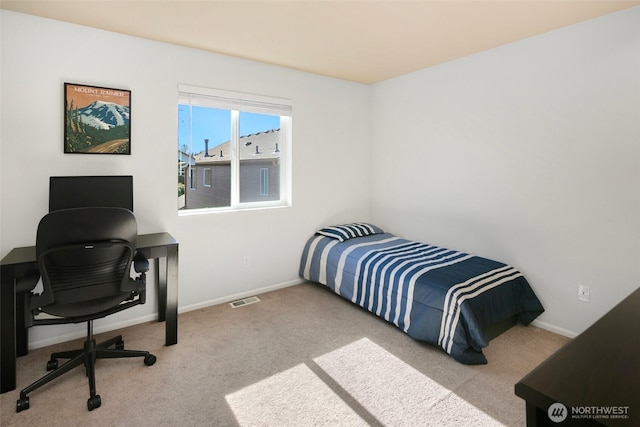 carpeted bedroom featuring visible vents and baseboards