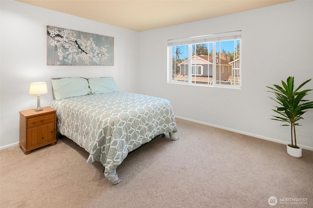 carpeted bedroom with baseboards