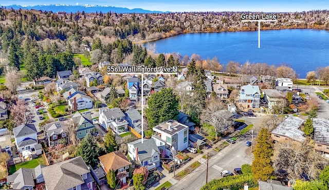 bird's eye view with a residential view and a water view