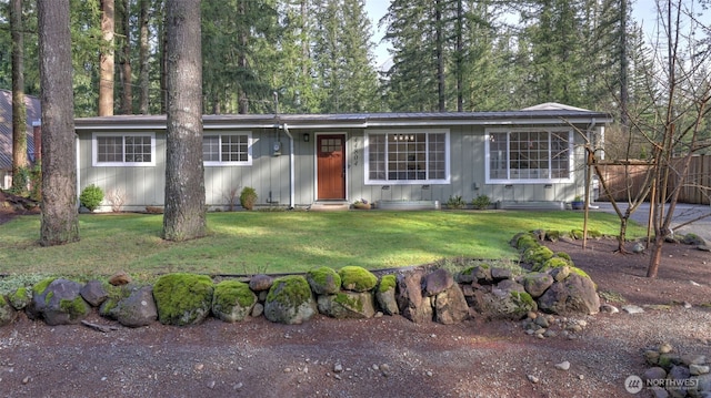 ranch-style house with a front lawn