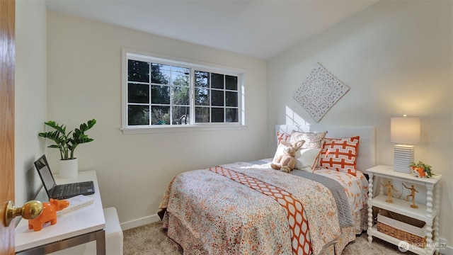 carpeted bedroom with baseboards