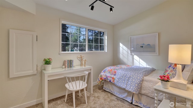 carpeted bedroom with baseboards