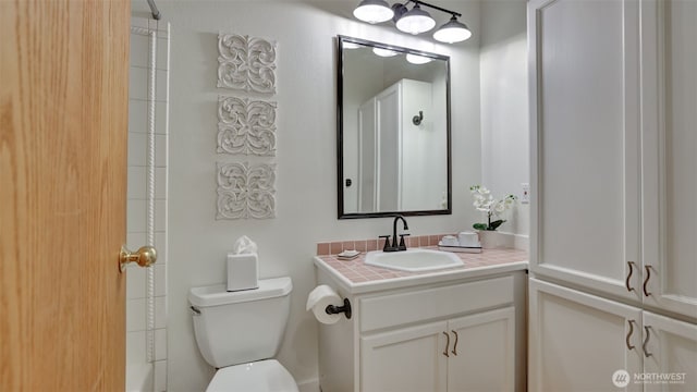 full bath featuring toilet and vanity