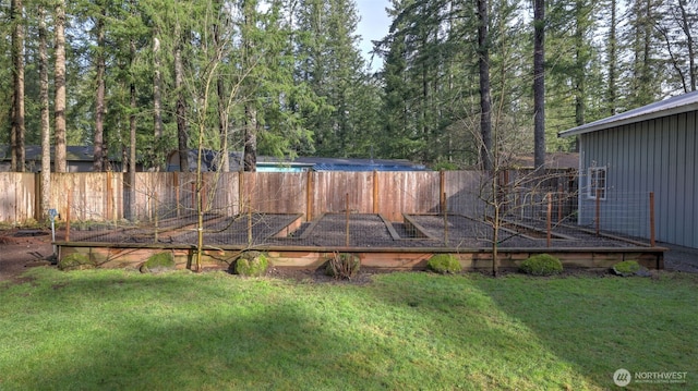 view of yard featuring a wooden deck and fence