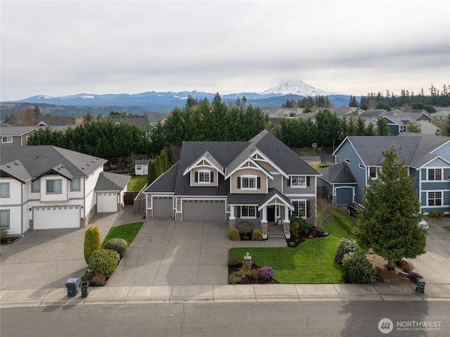 drone / aerial view with a mountain view and a residential view