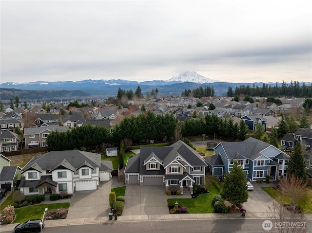 drone / aerial view with a residential view and a mountain view