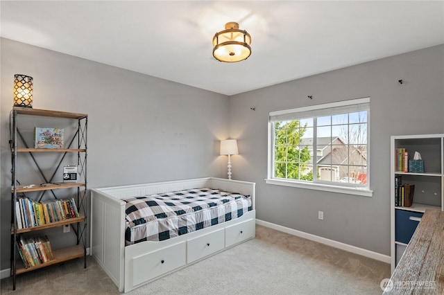 bedroom featuring baseboards and carpet floors