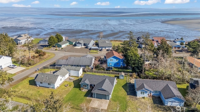 birds eye view of property featuring a water view and a residential view