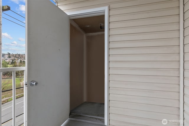 property entrance with a balcony