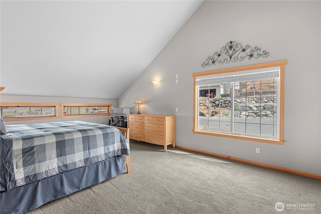 carpeted bedroom with baseboards and vaulted ceiling