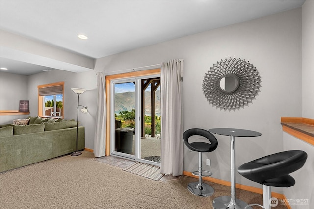 doorway featuring recessed lighting, a healthy amount of sunlight, and baseboards