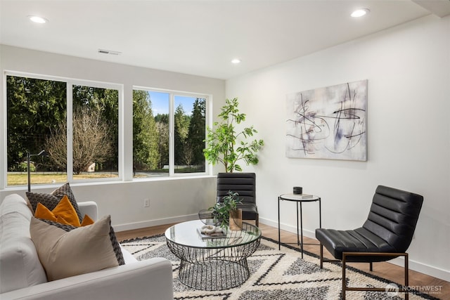 interior space with visible vents, recessed lighting, baseboards, and wood finished floors