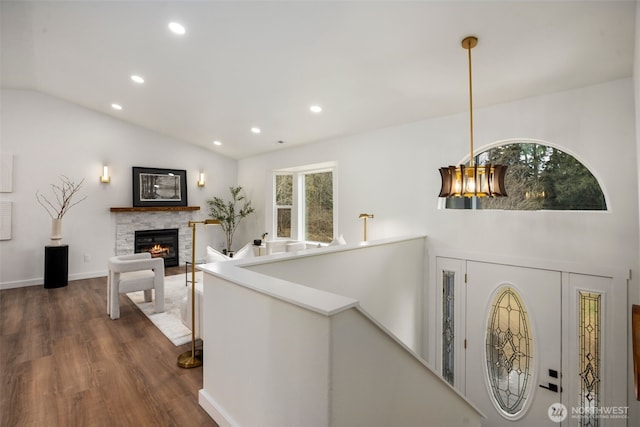 hallway featuring recessed lighting, an upstairs landing, dark wood-type flooring, and lofted ceiling