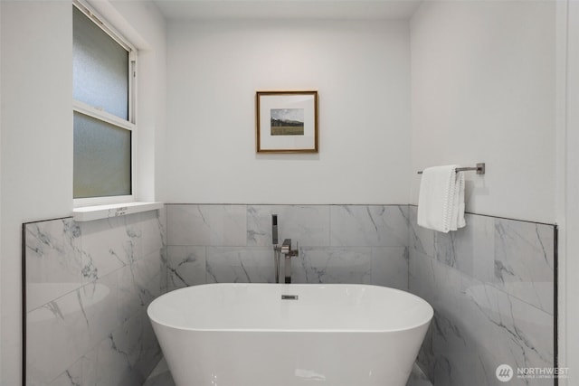 bathroom with a freestanding tub