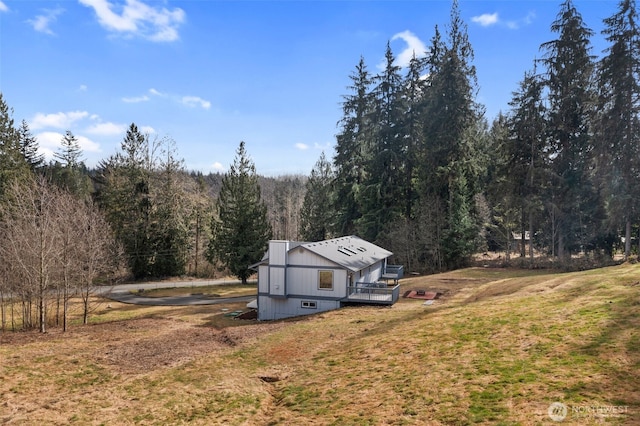 exterior space featuring a view of trees