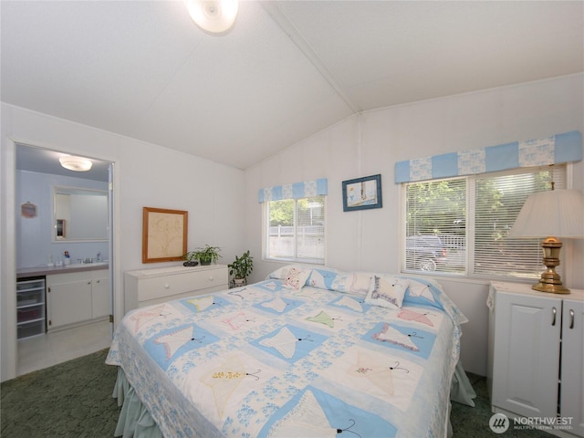 bedroom featuring vaulted ceiling, tile patterned flooring, a sink, and bar