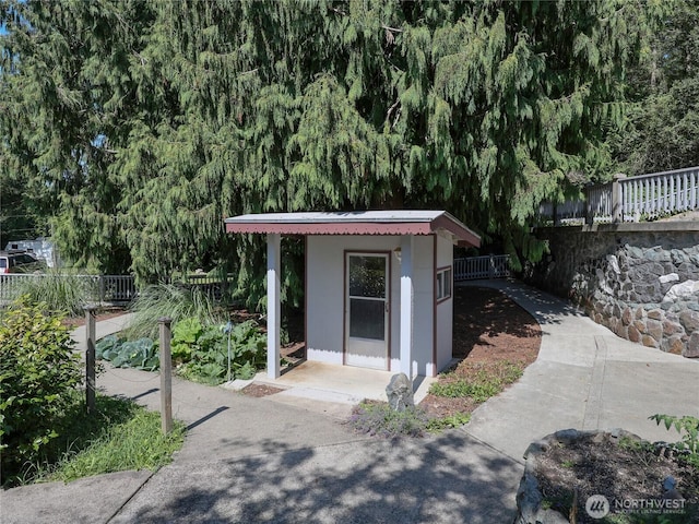 view of outdoor structure with an outdoor structure and fence