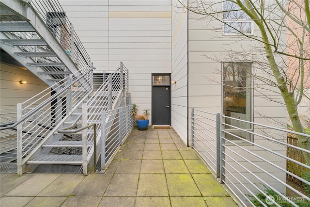 doorway to property with a patio area