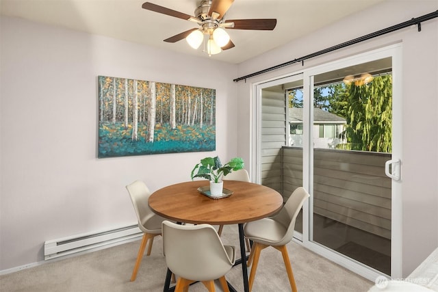 dining area with light carpet, ceiling fan, and baseboard heating