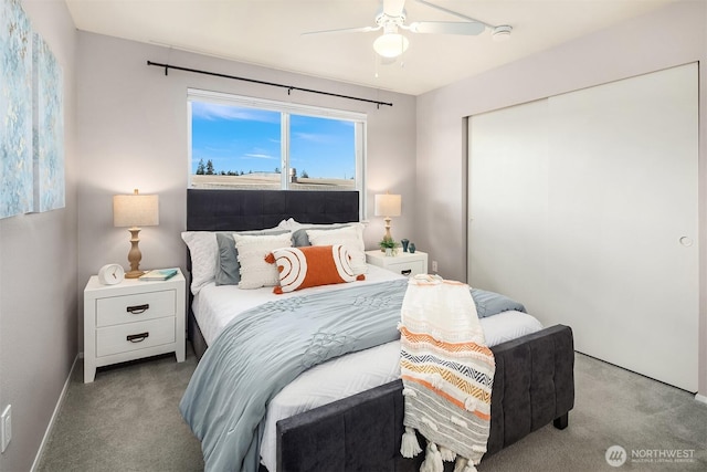 carpeted bedroom featuring ceiling fan, a closet, and baseboards