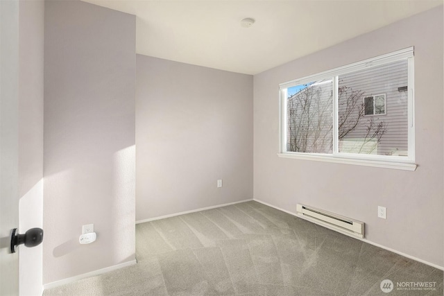 carpeted empty room with baseboards and baseboard heating