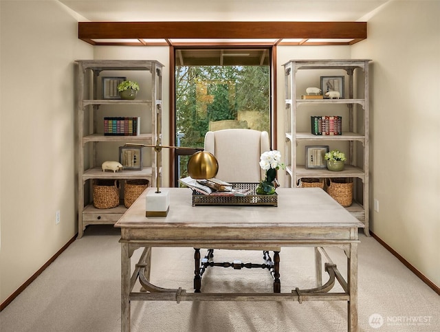 home office featuring baseboards and carpet