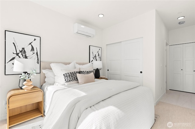 bedroom featuring recessed lighting, a closet, an AC wall unit, and tile patterned floors