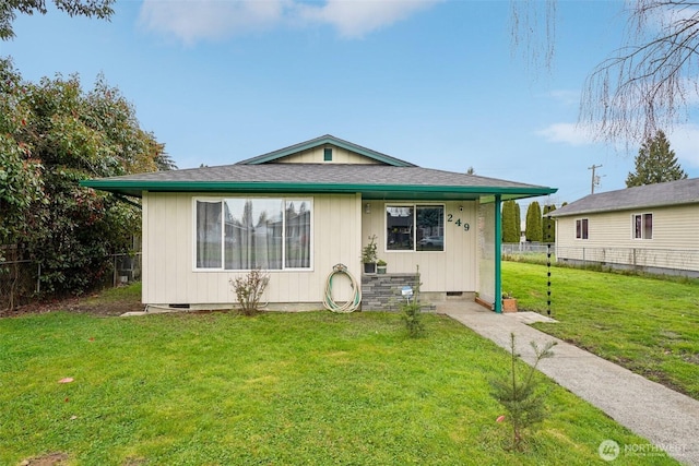 bungalow featuring crawl space, a shingled roof, a front yard, and fence