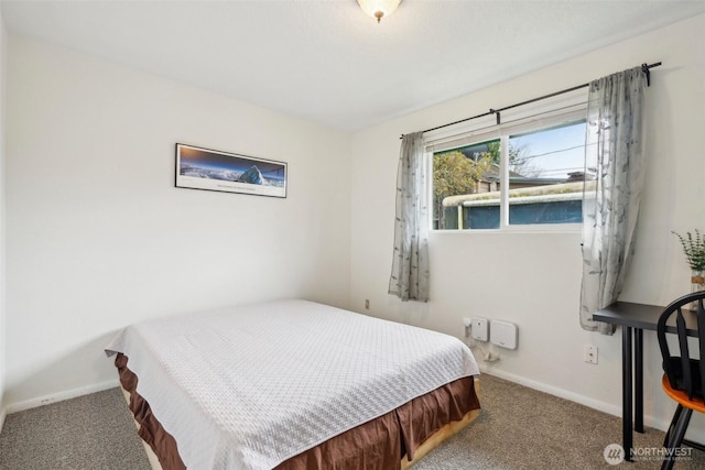 carpeted bedroom with baseboards