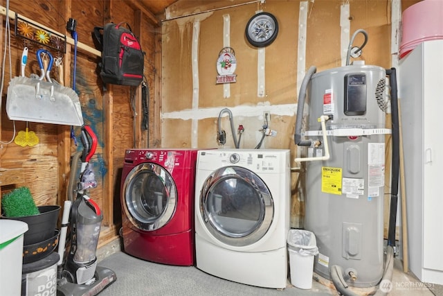 washroom with washing machine and dryer and heat pump water heater