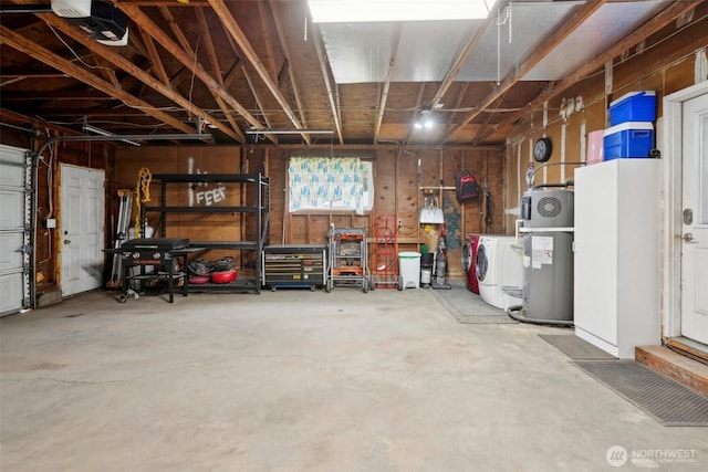 garage featuring washer / clothes dryer and water heater