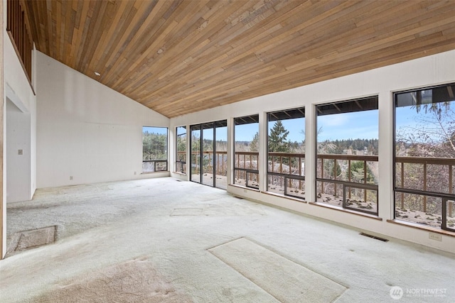 unfurnished sunroom with lofted ceiling, wooden ceiling, and visible vents